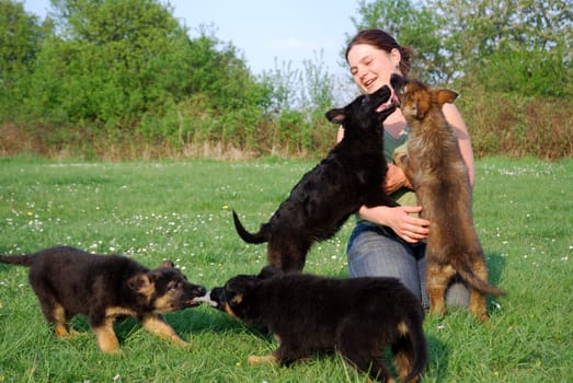 Woman with German Shepherd puppy