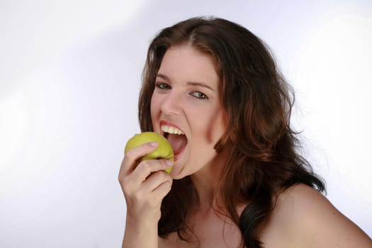 Portrait Of A Woman Biting A Green Apple