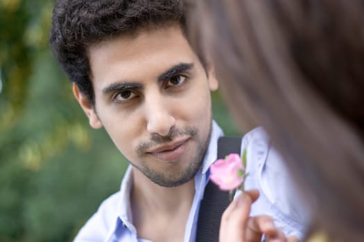 Handsome Young Man Receiving A Flower
