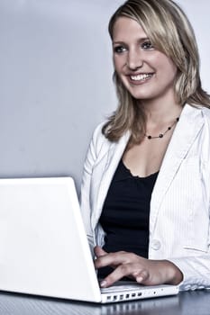 Smiling Blond Woman With Laptop