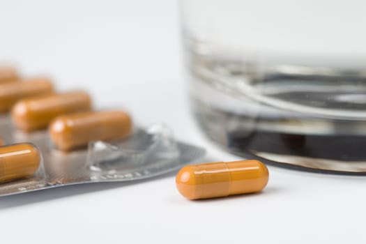 Pill before glass