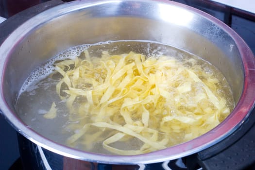 Ribbon noodles in a pot