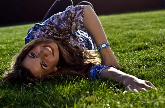 Photo Of A Cute Girl Lying On Grass