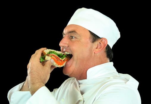 Chef rips into a fresh healthy salad sandwich.