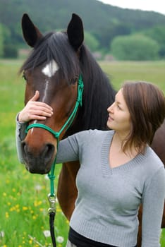 Young woman with horse