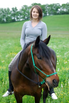 Young woman with horse