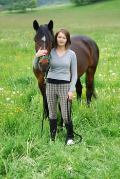 Young woman with horse