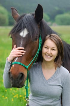 Young woman with horse