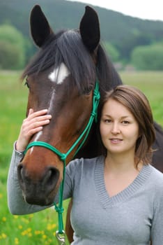 Young woman with horse