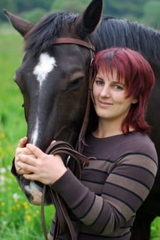 Young woman with horse