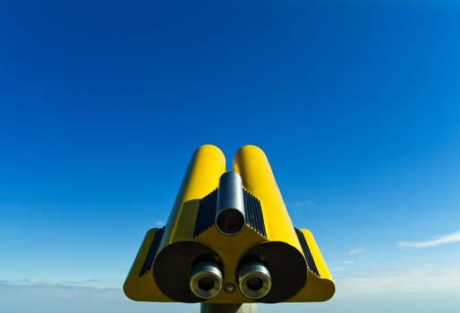Yellow telescope,blue sky
