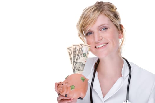 Young female doctor with piggy bank