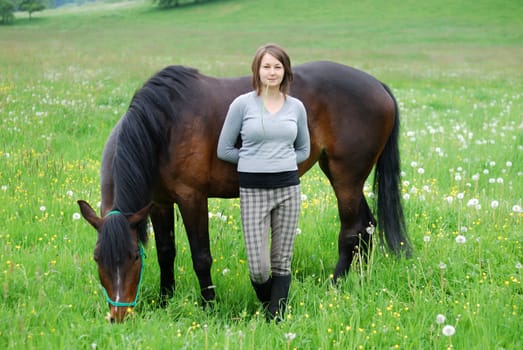 Young woman with horse