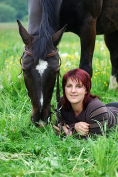 Young woman with horse