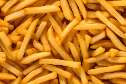 seamless texture and full-frame background of piled French fries, neural network generated image. Not based on any actual scene or pattern.