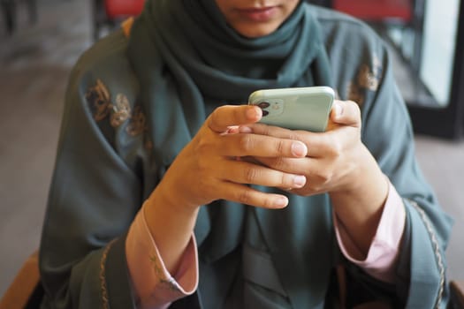 close up of women hand holding smart phone.