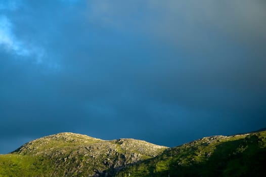 Dark clouds over a mountain