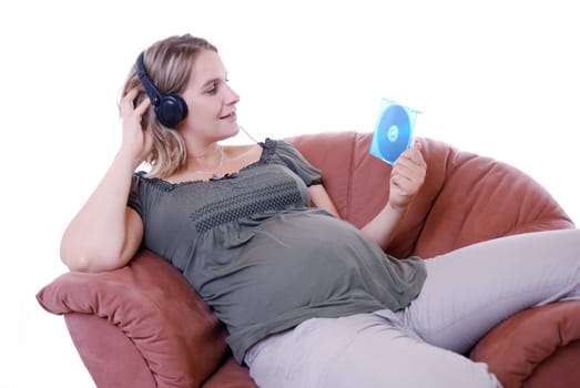 Pregnant woman listens to music