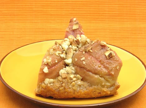 A piece of apple pie on ceramic plate