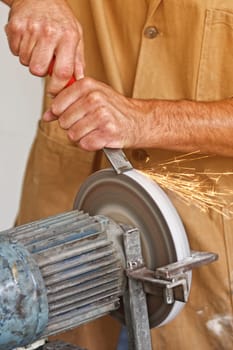 manual worker sharp his tool