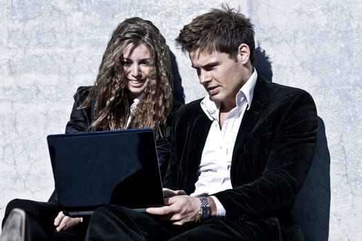 Young Corporate Couple With Laptop