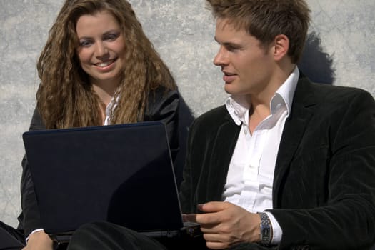 Successful Man And Woman With Laptop