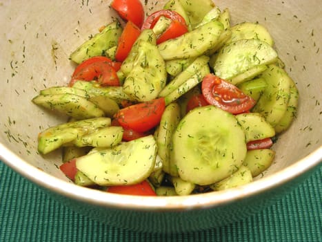 Cucumber and tomatoes with salad dressing