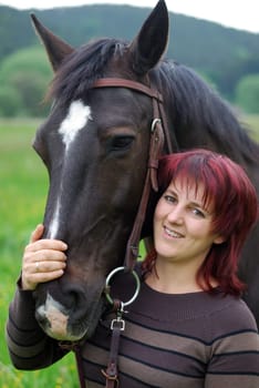 Young woman with horse