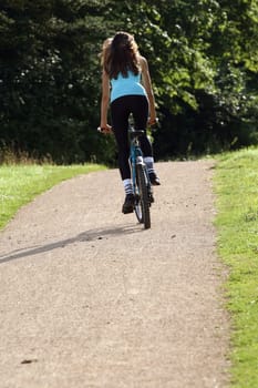 Woman cycling in park