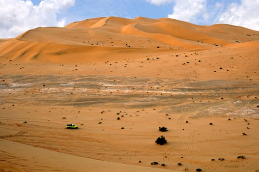 Jeep in the sand dunes of the Sahara