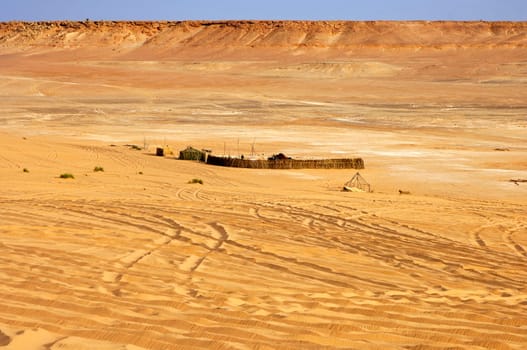 Temporary dwelling of Tuareg nomads in a wadi of the Libyan Desert,Sahara