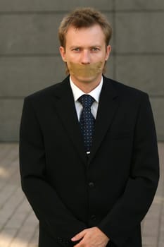 Man with adhesive on his Mouth