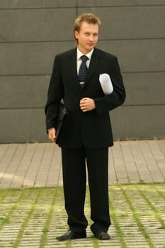 businessman with bag and blueprint