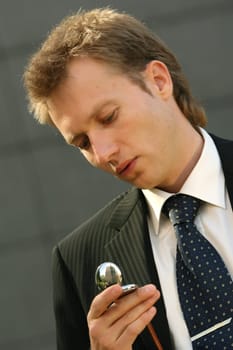 businessman looking at watch
