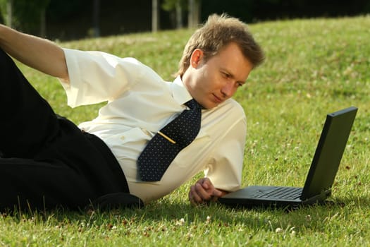 man with laptop working outdoor