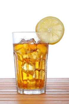 Glass of ice tea with lemon