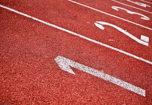 Closeup Of Numbered Running Track Lanes