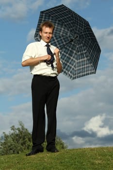 businessman holding umbrella