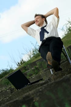relaxing businessman outdoors