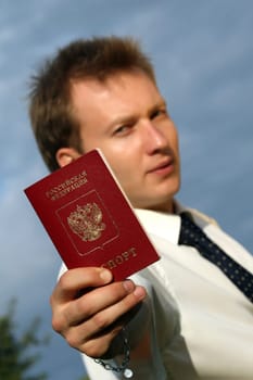 man holding russian passport