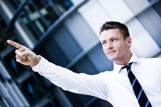 Handsome Man In A Corporate Attire Pointing Up