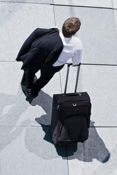 Corporate Man With Rolling Luggage