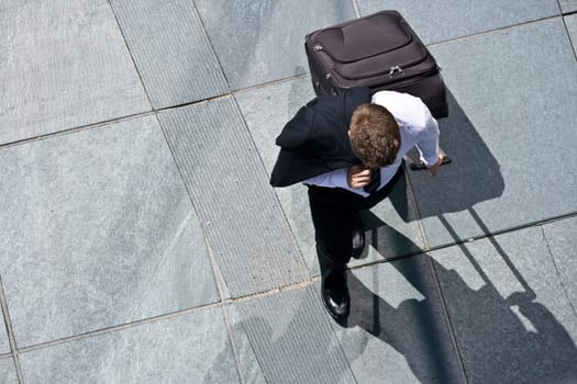 Corporate Man With Luggage And Costume Jacket