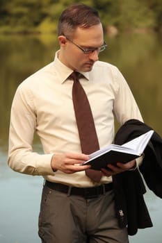 businessman looking in his organizer