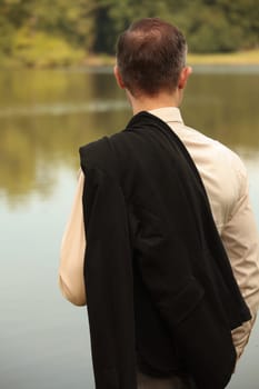 man with jacket at the shore