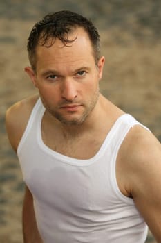 portrait of tired man in undershirt