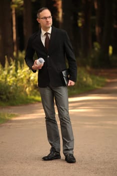 thinking businessman outdoors