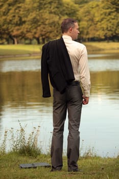 man with jacket at the shore