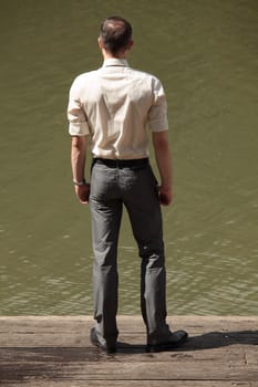 man on the wooden pier