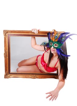Masked woman in picture frame.